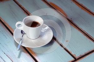Coffee cup on old wooden table
