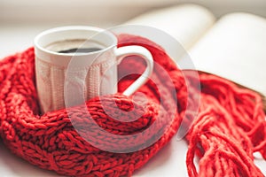 Coffee cup and open book