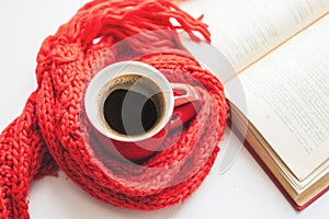 Coffee cup and open book