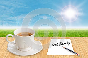 Coffee cup and paper with word Good morning