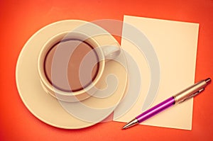 Coffee cup and papernote on table