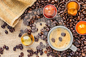 Coffee cup placed on a bed of coffee beans