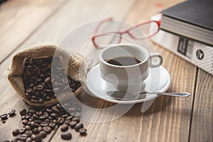 Coffee cup with reading glasses