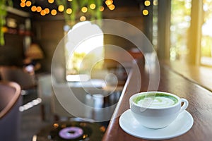 Coffee cup in relax time on blur people in coffee shop background.