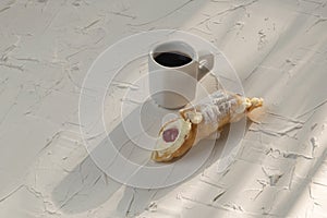 Coffee cup and ricotta cannolli