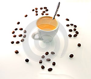 Coffee cup and roasted beans arranged as clock face on white background. Coffee time symbol