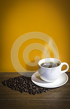 Coffee cup and roasted coffee beans