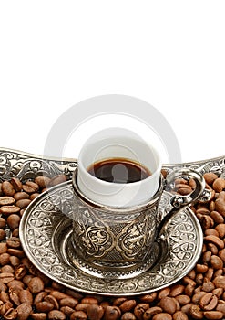 Coffee cup and roasted coffee beans isolated on a white background. Free space for text