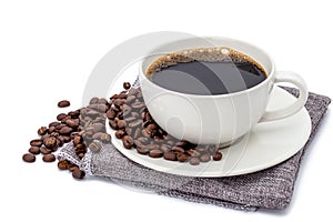 Coffee cup on sackcloth isolated on white background