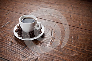 Coffee cup and saucer on wooden table