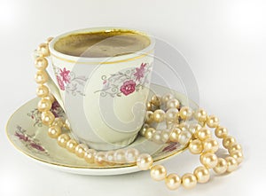 Coffee cup with sea perls necklace