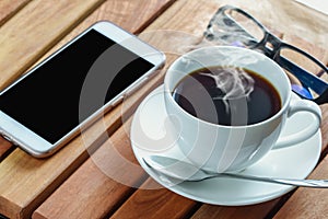 Coffee cup and smart phone