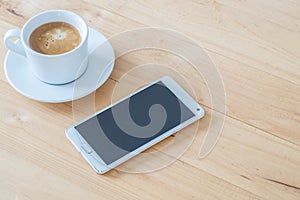 Coffee cup and smartphone