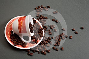 Coffee cup spilling beans