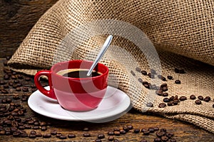 Coffee cup with spoon coffeebeans and gunny textile