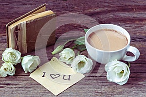 Coffee cup with spring flower lisianthus and notes I love you on