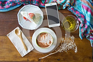 Coffee cup and strawberry cake in coffee shop ,coffee relax time