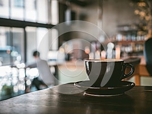 Coffee Cup on table Cafe shop Interior Blur people background