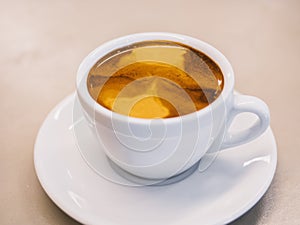 Coffee with Crema Coffee cup on table photo