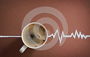 Coffee cup top view and heart beats cardiogram