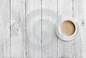 Coffee cup top view on white wood table background