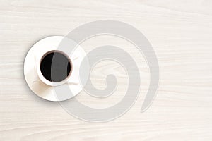 Coffee cup top view on white wooden table background