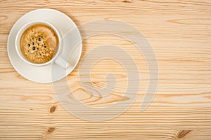 Coffee cup top view on wooden table