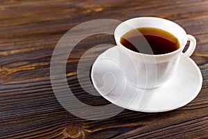 Coffee cup top view on wooden table background