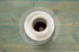 Coffee cup top view on wooden table background