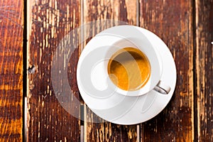 Coffee cup top view on wooden table background