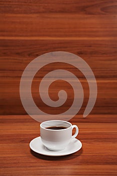 Coffee cup top view on wooden table background