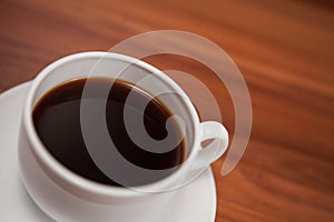 Coffee cup top view on wooden table background