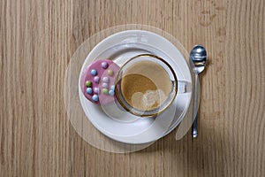 Coffee cup top view on wooden table background