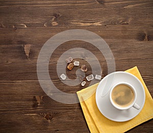 Coffee cup top view on wooden table background