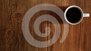 Coffee cup top view on wooden table background