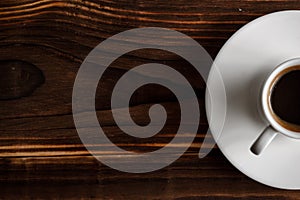 Coffee cup top view on wooden table background