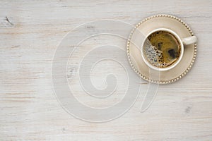 Coffee cup top view on wooden table texture background