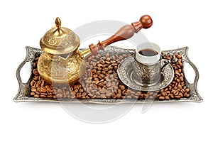 Coffee cup, tray with arabic decoration and coffeepot isolated on a white background