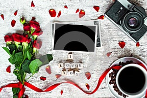 Coffee cup, vintage retro camera with photo frame, red roses and i love you inscription