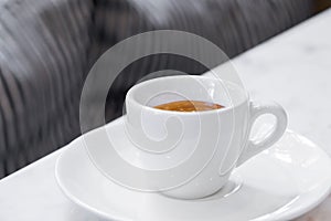 Coffee cup on white marble table