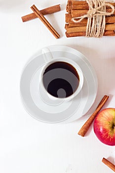 Coffee cup on white wooden table top view on old wooden.