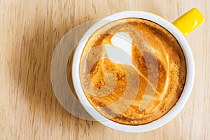 Coffee cup on wood table.