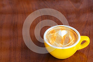 Coffee cup on wood table.