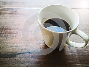 Coffee cup on wood table morning time
