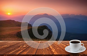 Coffee cup on wood table and view of beautiful nature background