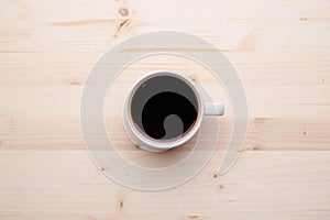 Coffee cup on wooden