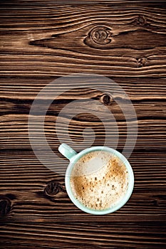 Coffee cup on wooden background