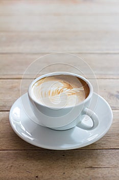 Coffee in a cup on a wooden table