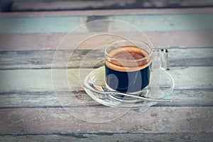 Coffee cup on wooden table in vintage