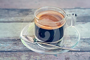 Coffee cup on wooden table in vintage